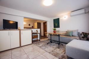 a living room with a couch and a table at Urban Studio Apartments in Strumica