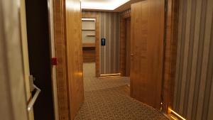 a hallway with two doors and a room with at Green Prusa Hotel in Bursa