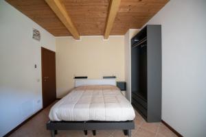 Кровать или кровати в номере Affittacamere Casa Galiè