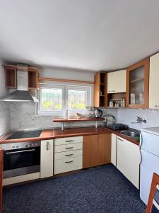 Kuchyňa alebo kuchynka v ubytovaní ApHEARTments