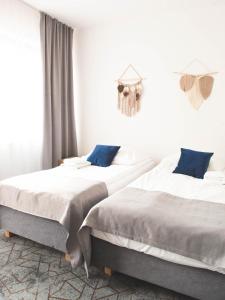 Łóżko lub łóżka w pokoju w obiekcie Hotel Beskidian
