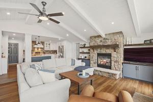 a living room with a couch and a fireplace at Todholm Muskoka in Port Carling