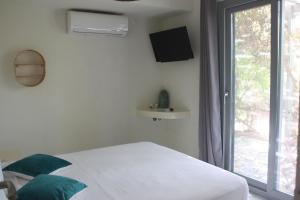 Postel nebo postele na pokoji v ubytování Orkeli casa
