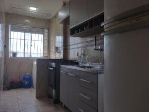Dapur atau dapur kecil di TerraTemporada Apartamento central em campos