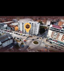 an aerial view of a city with a large building at apartment gjilan in Gjilan