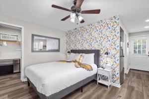 a bedroom with a bed and a ceiling fan at Downtown Kimmswick Studio Newly Renovated 