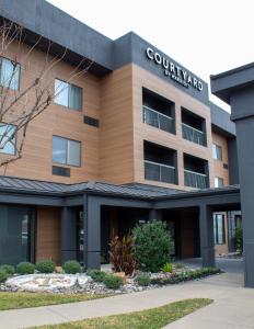 a view of a campus building with a courtyard at Courtyard by Marriott Bryan College Station in College Station