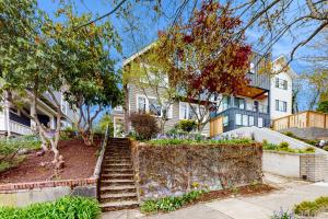 a house with stairs in front of a house at Harbor Haven in Seattle