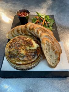 a plate of food with bread and a pie at Dartmoor Halfway Inn in Newton Abbot