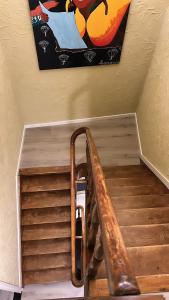 a stairway with a painting on the wall at Bed & Breakfast Serendipity in Valkenburg