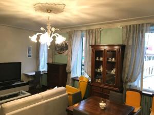 a living room with a couch and a table at La Dimora del Centro in Iesi
