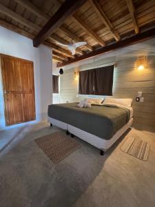 Postel nebo postele na pokoji v ubytování MARIBY HOLBOX