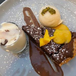 a plate of desserts with chocolate and ice cream at Haigs Hotel in Coventry +24 photos