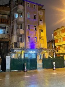 a building with purple lights on the side of it at 1643 suit apart in Çekirge
