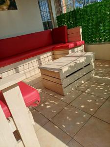 two benches sitting on a patio in a building at 5 On Cologne in Germiston