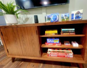 a wooden book shelf with books on it at Downtown Whitefish awaits you at Central Ave Suite in Whitefish