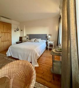A bed or beds in a room at Relais Valpolicella B&B