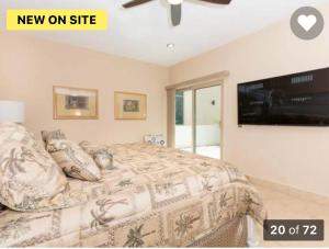 a bedroom with a bed and a flat screen tv at A Coastal House for Relaxation near Golf Course And Beach Front in Puerto Peñasco