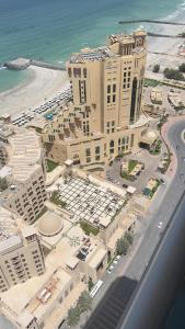 an aerial view of a resort with a beach and buildings at R2)Sweet Home fantastic city and sea view at beachإطلالة رائعة على المدينة والبحر على الشاطئ in Ajman 