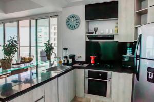 Virtuvė arba virtuvėlė apgyvendinimo įstaigoje Playa Cartagena Apartments