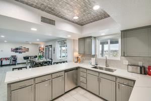 a large kitchen with white counter tops and cabinets at Lake Havasu City Home 4 Mi to London Bridge Beach in Lake Havasu City