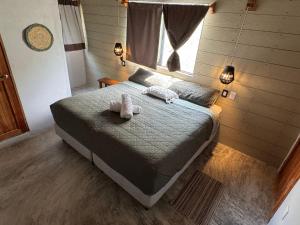 Postel nebo postele na pokoji v ubytování MARIBY HOLBOX