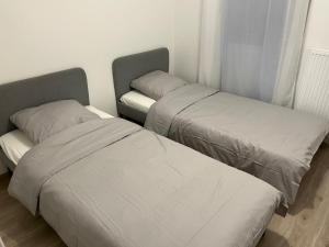 Postel nebo postele na pokoji v ubytování Appartement cosy à Bron