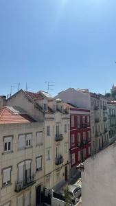 a group of buildings in a city at Quarto Alameda in Lisbon
