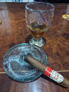 a glass ash tray with a cigar and a glass cup at RedStone Cabin in El Oro de Hidalgo