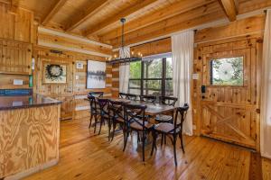 a dining room with a table and chairs at Autumns Peak in Sevierville