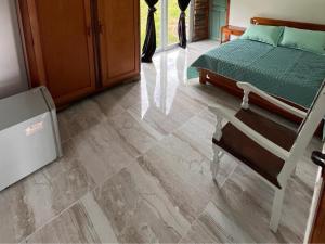 Postel nebo postele na pokoji v ubytování Hotel Chalet en montaña Manizales