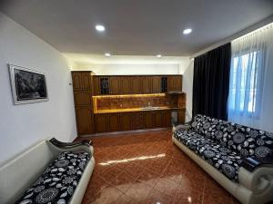 a living room with a couch and a sink at Villa For Rent in Durrës