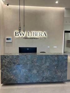 a large marble counter in a room with a sign at Belgrade Waterfront-Beograd na vodi Galaxy Apartment in Belgrade