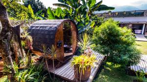 a tree house in the middle of a garden at Terasu Hotel Boutique Salento in Salento