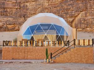 a dome house in the middle of the desert at Ramez luxury camp in Disah
