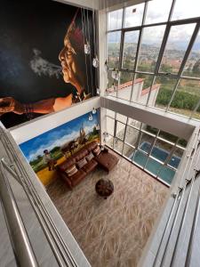 a room with a large painting on the wall at Terra Imperial in Chachapoyas