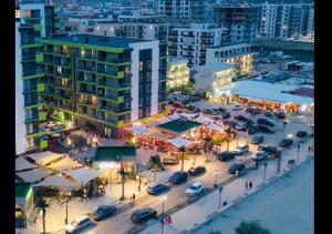 an overhead view of a parking lot in a city at night at Azur 148 - Pool & Spa Beach Resort in Mamaia
