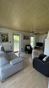 a living room with a couch and a table at 069 Riverside Vikendica - Banja Luka in Rekavice