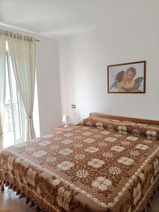 Кровать или кровати в номере La Casa di Adelaide