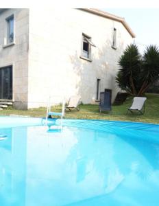 The swimming pool at or close to O IGREXARIO