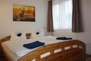 A bed or beds in a room at Haus Magdalena