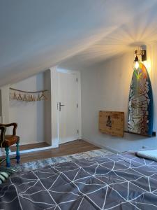 a bedroom with a bed and a stained glass window at Lisbon Soul Surf Camp in Cascais
