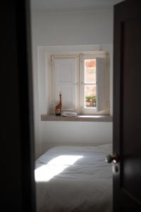 Ένα ή περισσότερα κρεβάτια σε δωμάτιο στο Private Terrace Refúgio