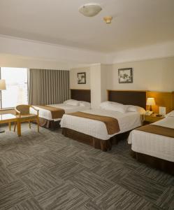 Postel nebo postele na pokoji v ubytování Hotel Miramar