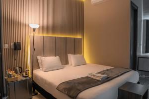 Voodi või voodid majutusasutuse HOTEL NABU VALLEDUPAR toas