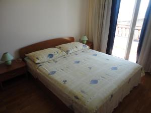 Postel nebo postele na pokoji v ubytování Apartments Maslina
