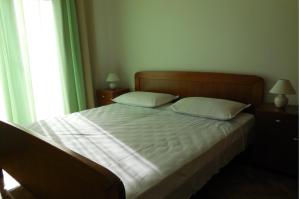 Postel nebo postele na pokoji v ubytování Apartments Maslina