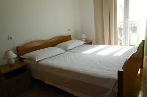 Postel nebo postele na pokoji v ubytování Apartments Maslina