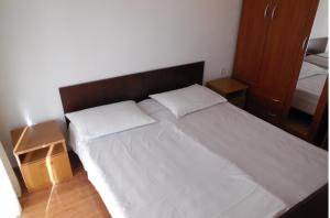 Postel nebo postele na pokoji v ubytování Apartments Maslina