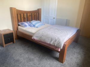 a bed with blue pillows on it in a bedroom at Renton Residence in Renton